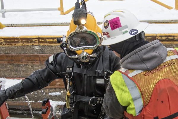 Close up of Nelosca diver and safety team